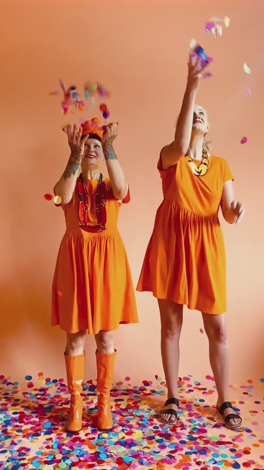 Load and play video in Gallery viewer, Edie Tee Dress Healing Orange
