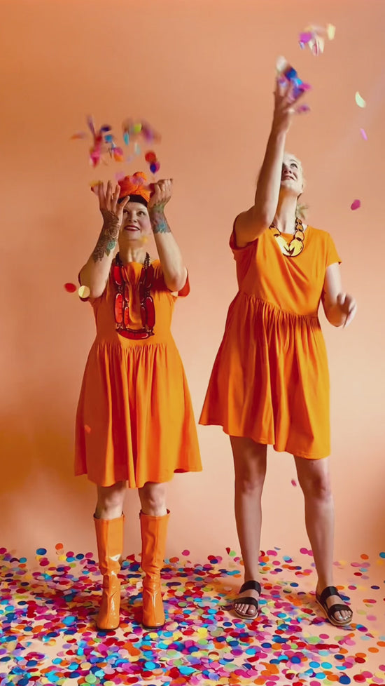 Load and play video in Gallery viewer, Edie Tee Dress Healing Orange
